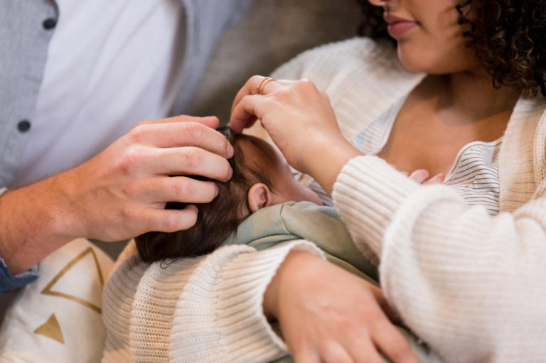 Adorable newborn baby with parents